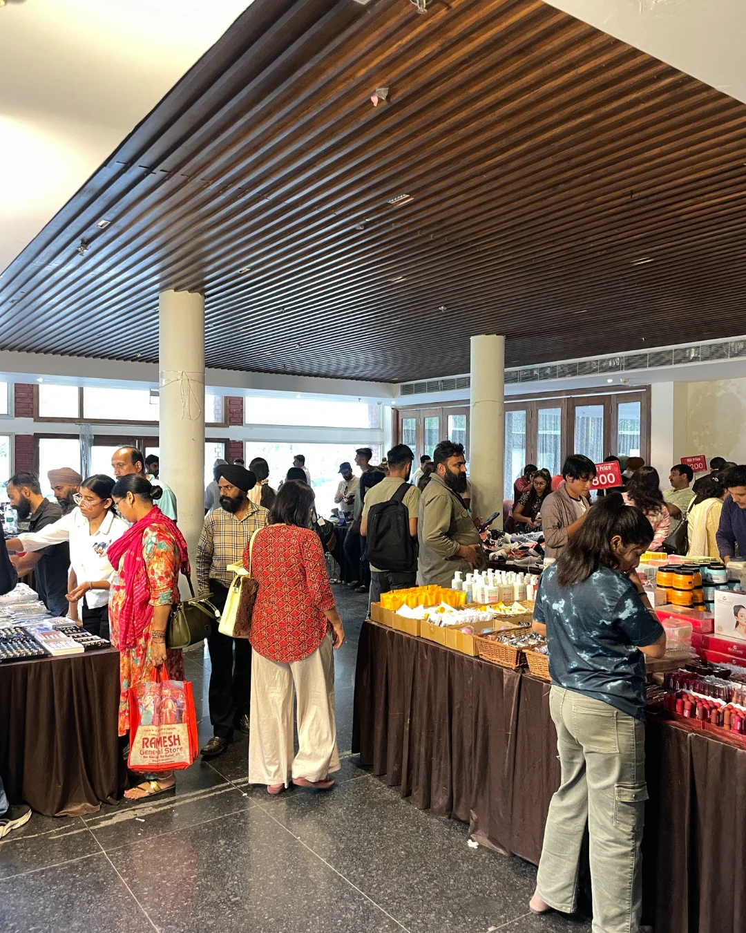 Fashion enthusiasts checking out deals